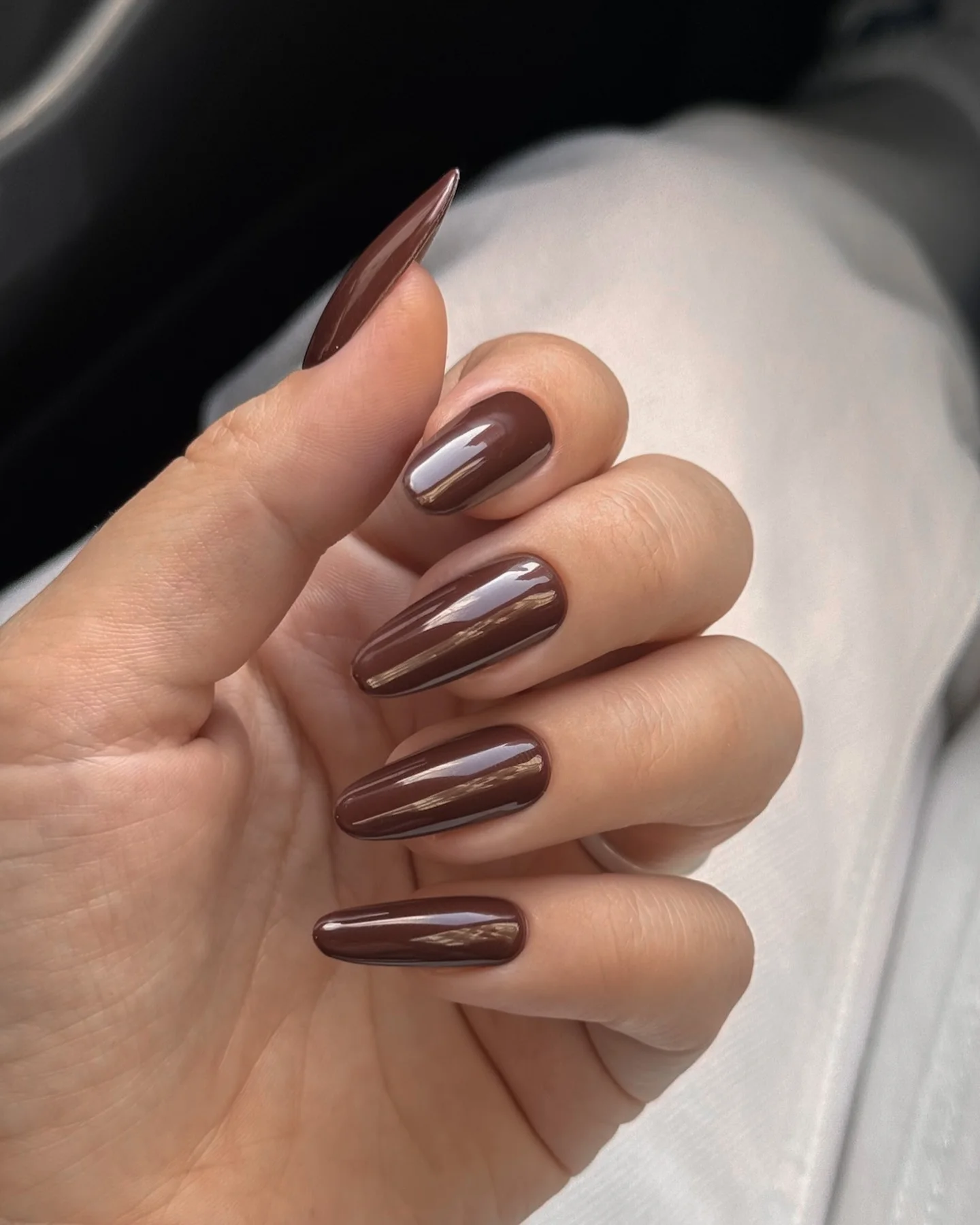fall manicure colors 2026 Glossy Cocoa Almond Nails With A Minimalist Finish