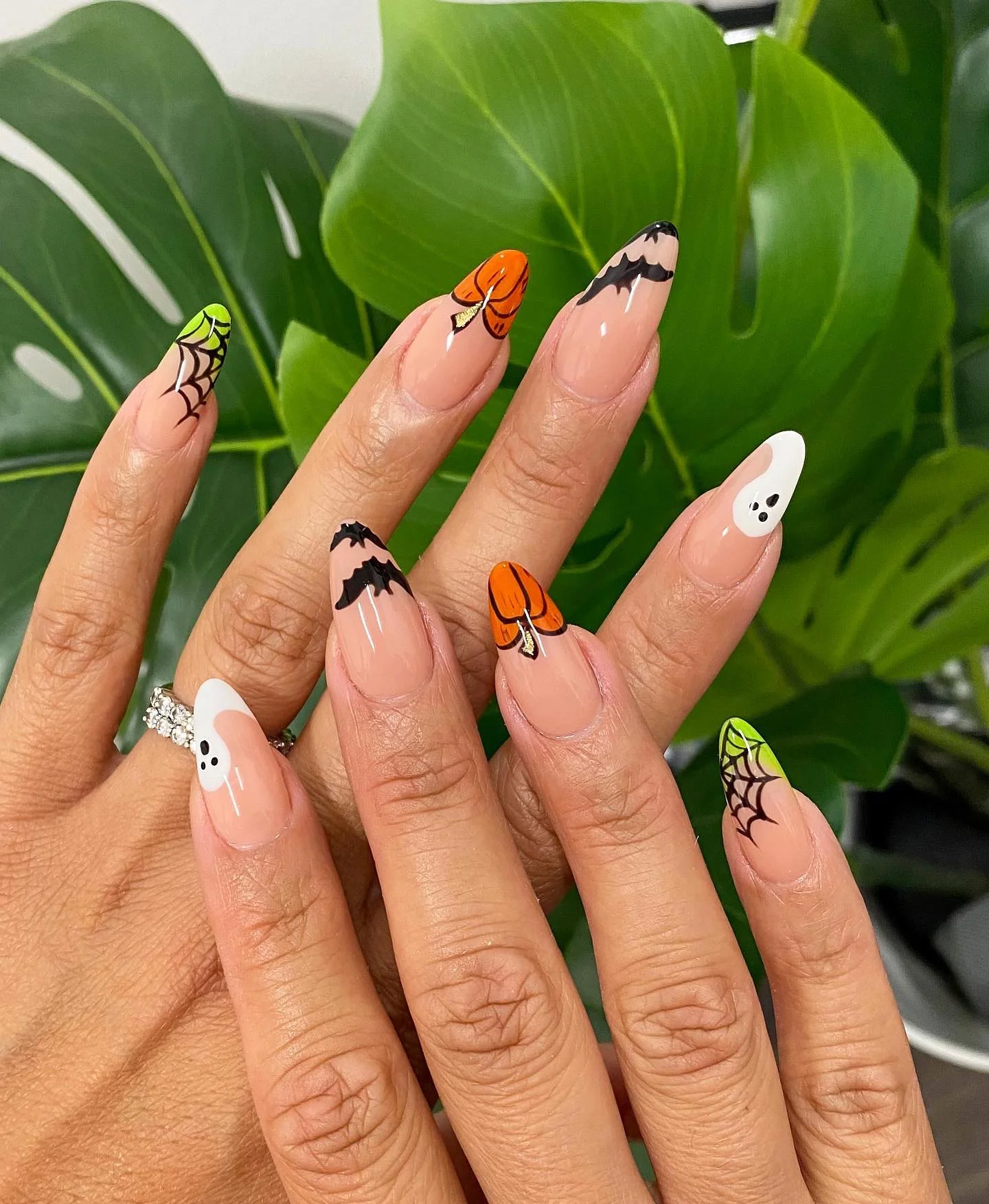 halloween nail art 2026 Long Almond Halloween Nails With Pumpkins And Spider Webs