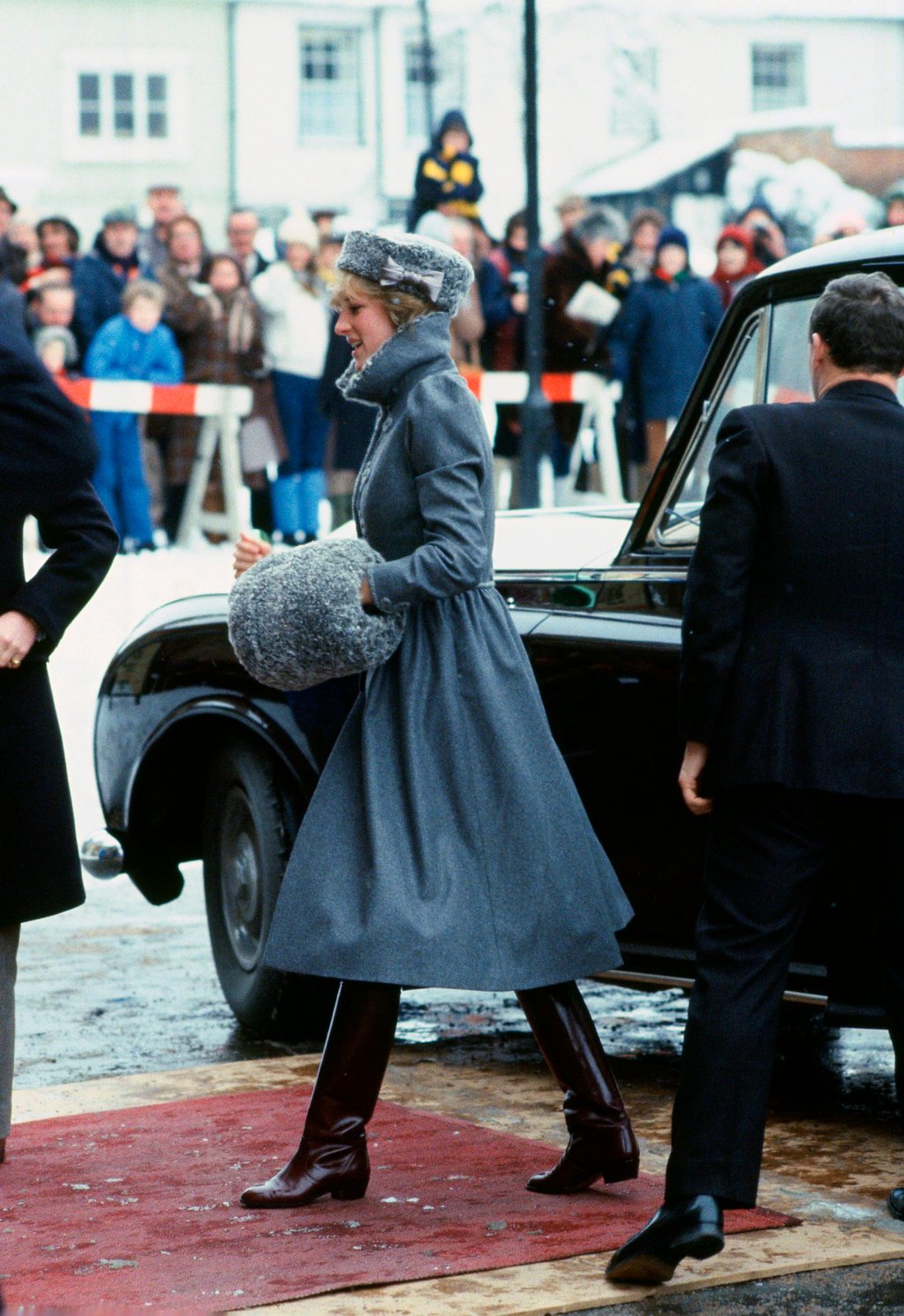 15 of Princess Diana's most chic winter fashion outfits: from her tan coat in London, a style later rocked by Meghan Markle and Kate Middleton, to a festive jumper with King Charles
