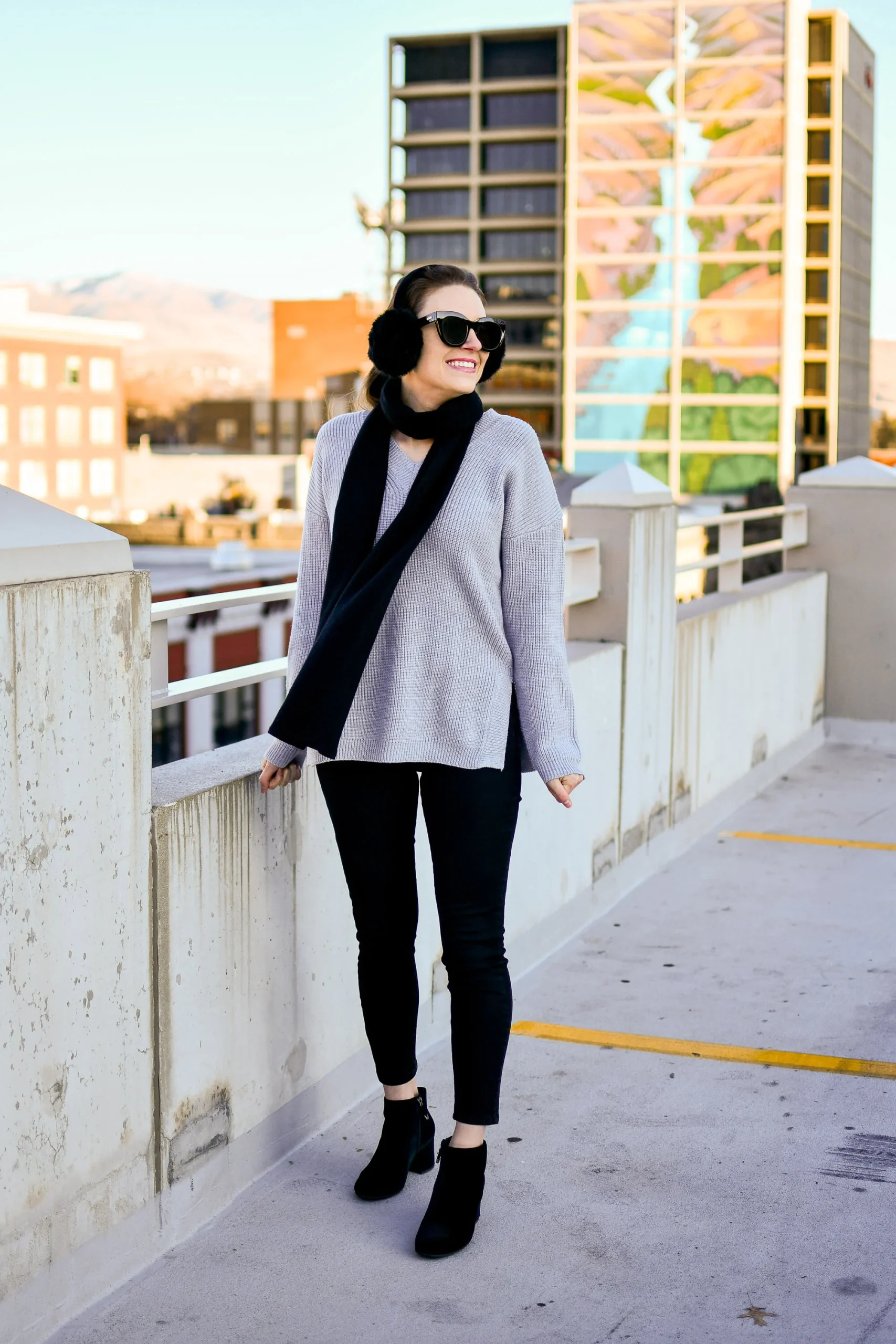Grey Knit Sweater with Black Skinny Pants and Earmuffs Grey Knit Sweater with Black Skinny Pants and Earmuffs — Neutral Winter Outfits