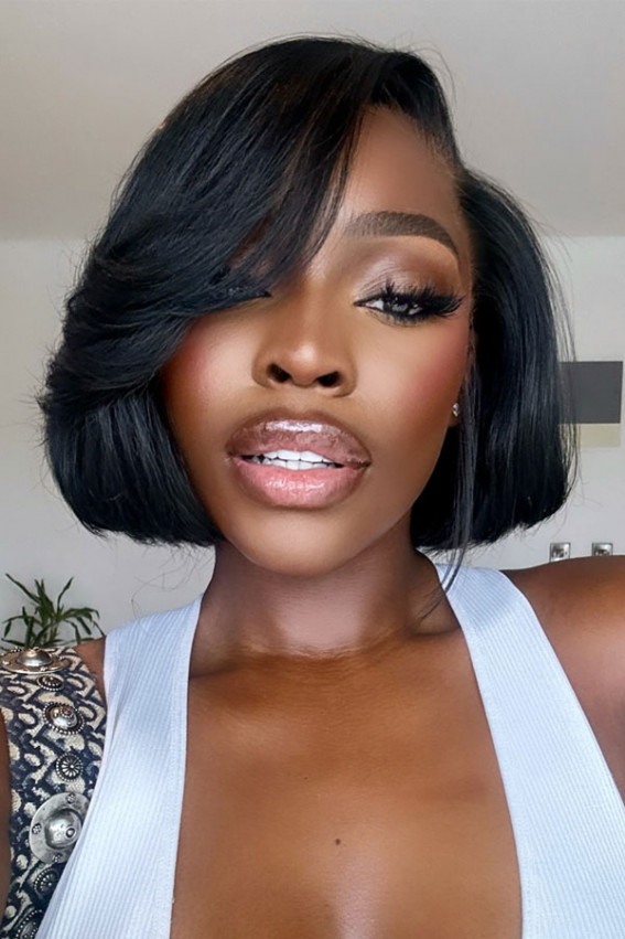 Chin-Length Bob With Voluminous Side-Swept Bangs Chin-Length Bob With Voluminous Side-Swept Bangs — Winter Haircuts for Black Women