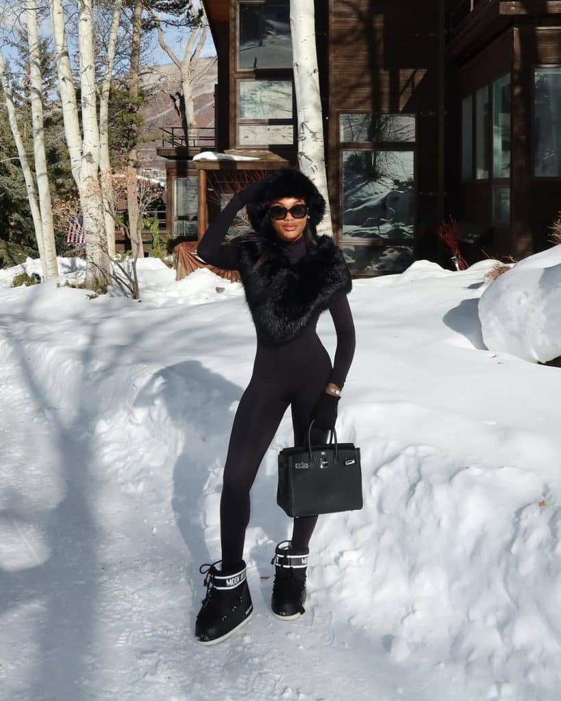 All-Black Jumpsuit with Fur-Trimmed Jacket and Hat All-Black Jumpsuit with Fur-Trimmed Jacket and Hat — Apres Ski Outfits