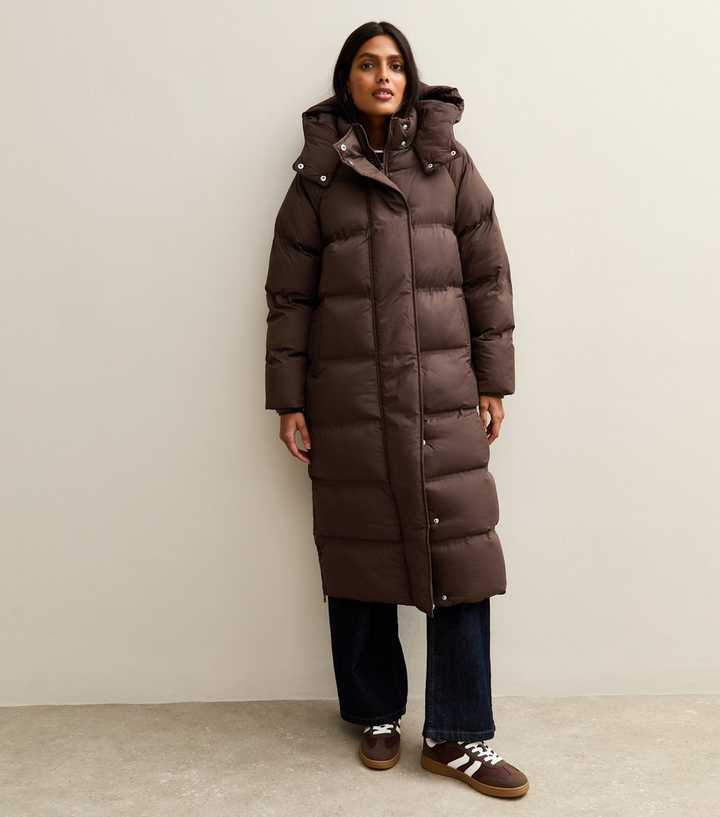 Brown Quilted Puffer with White Tee and Straight-Leg Jeans — Long Puffer Coat Outfits