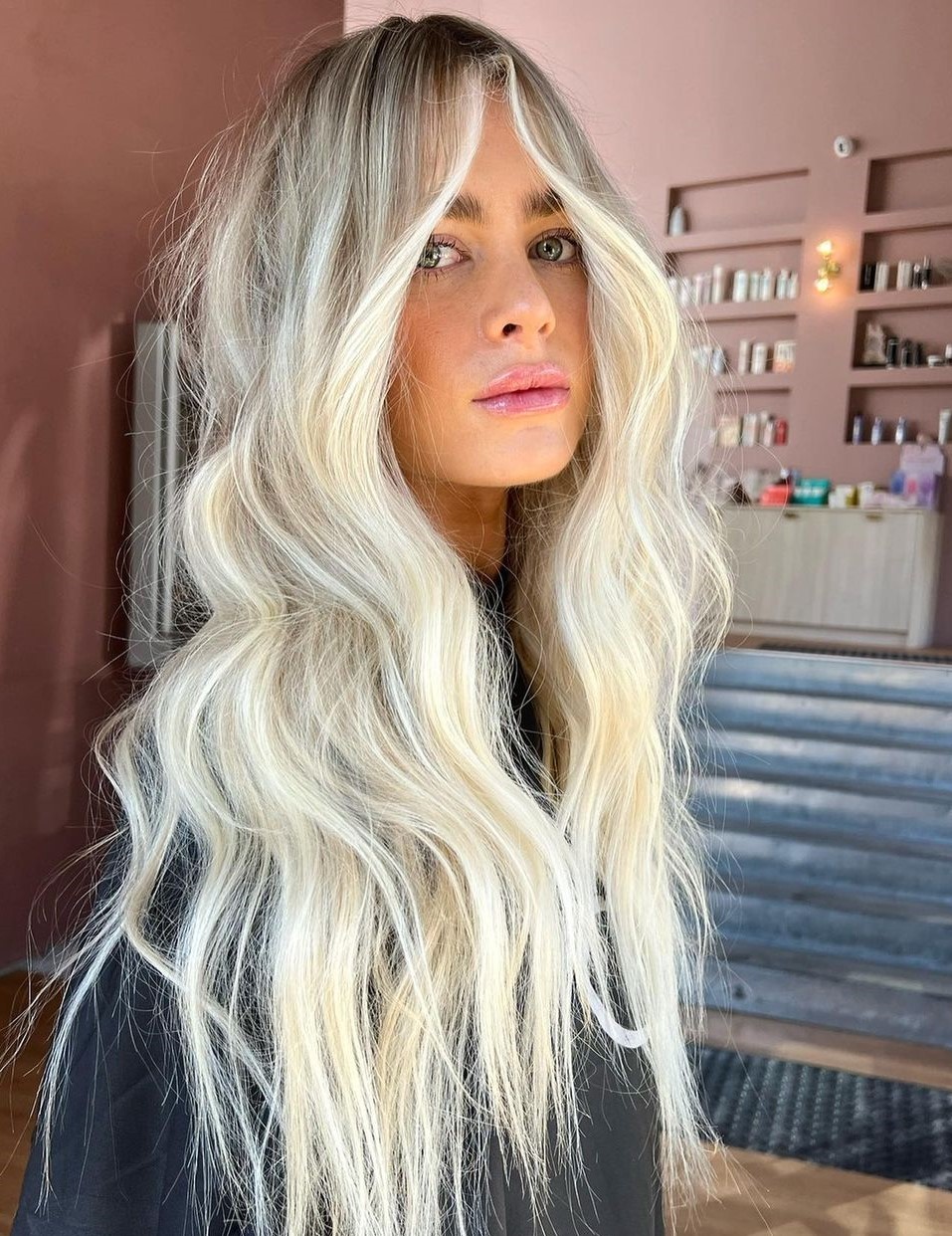 Wavy Platinum Balayage With Curtain Bangs Wavy Platinum Balayage With Curtain Bangs — Icy Blonde Hair