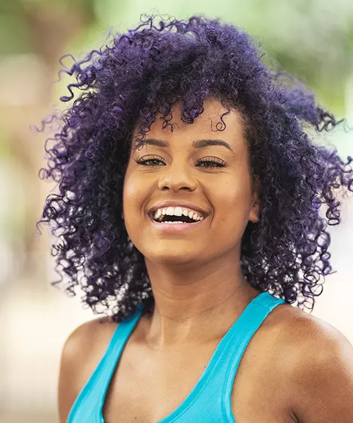 Vibrant Purple Mid-Back Curls — Winter Hair Colors for Black Women