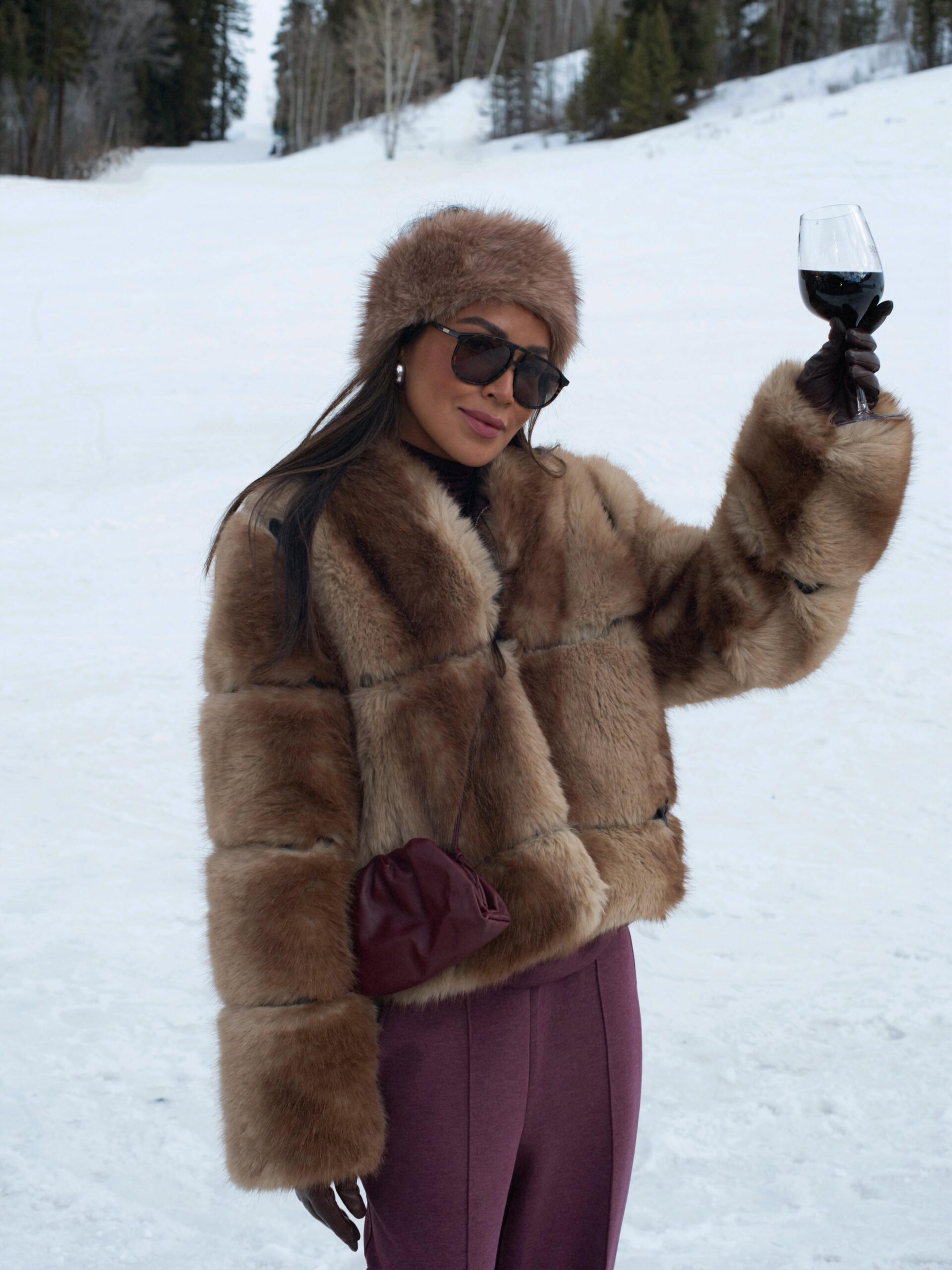 Brown Faux Fur Jacket with Burgundy Trousers and Fur Hat Brown Faux Fur Jacket with Burgundy Trousers and Fur Hat — Apres Ski Outfits