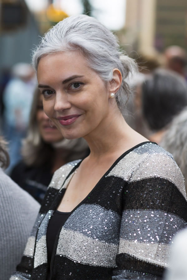 Light Gray Low Bun with Face-Framing Tendrils Light Gray Low Bun with Face-Framing Tendrils — Winter Haircuts for Gray Hair