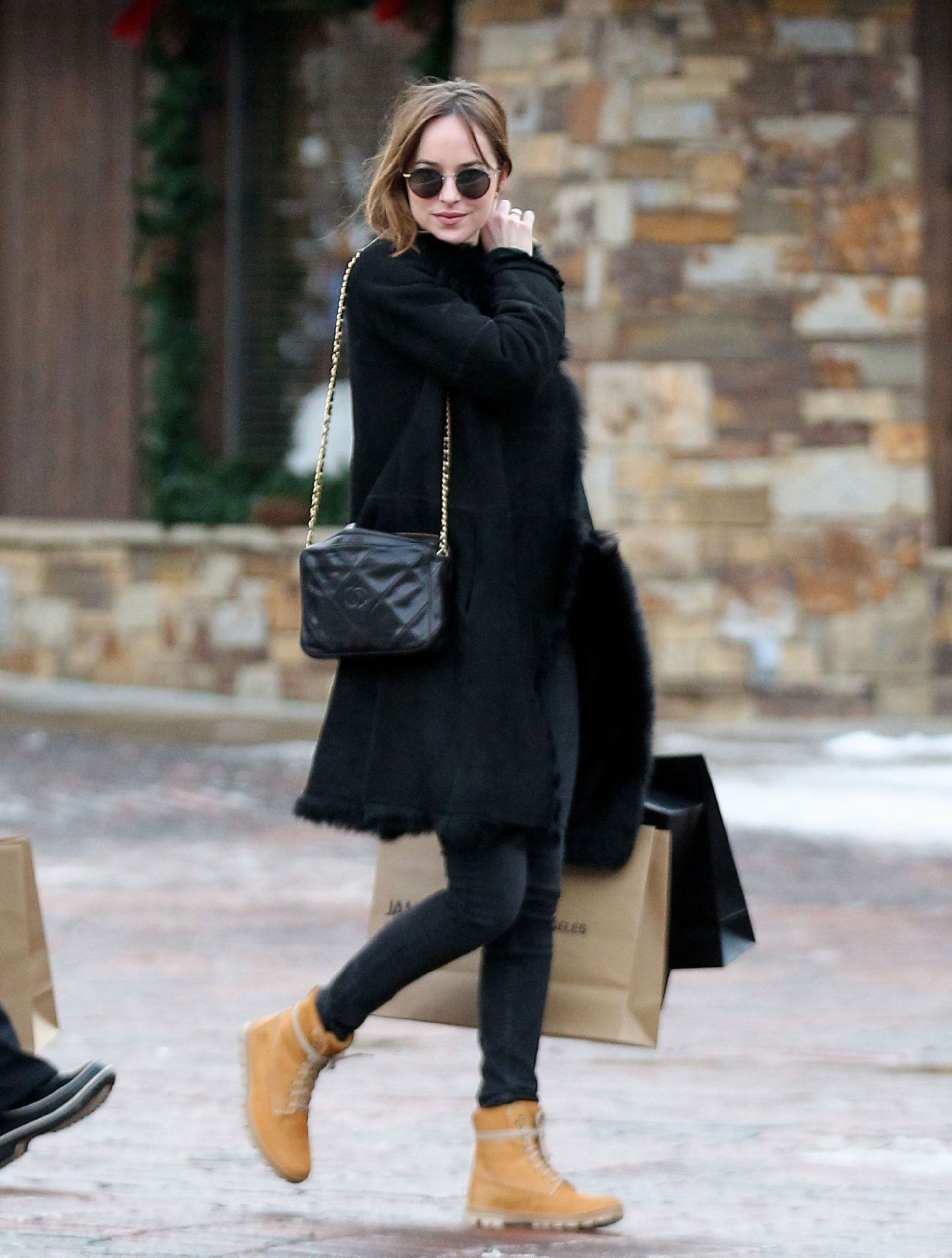 Chic Winter Casual: Tan Boots with Black Shearling Coat — Timberland Boots Outfits