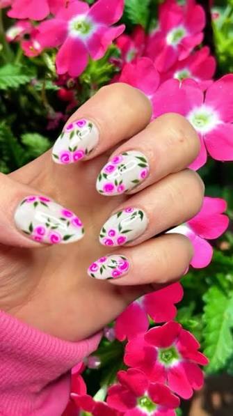 White Base with Pink and Green Floral Motifs — trendy almond nail designs