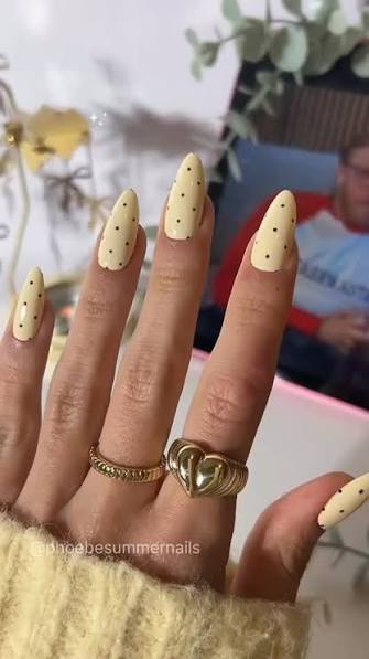 One Hand Close-Up Pale Yellow with Black Polka Dots One Hand Close-Up Pale Yellow with Black Polka Dots — yellow nail designs