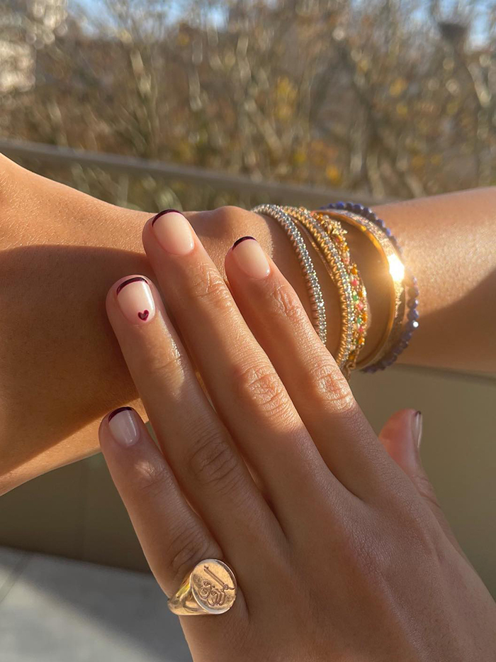 Nude Base with Dark Red Heart Tip Nude Base with Dark Red Heart Tip — trendy simple nail designs