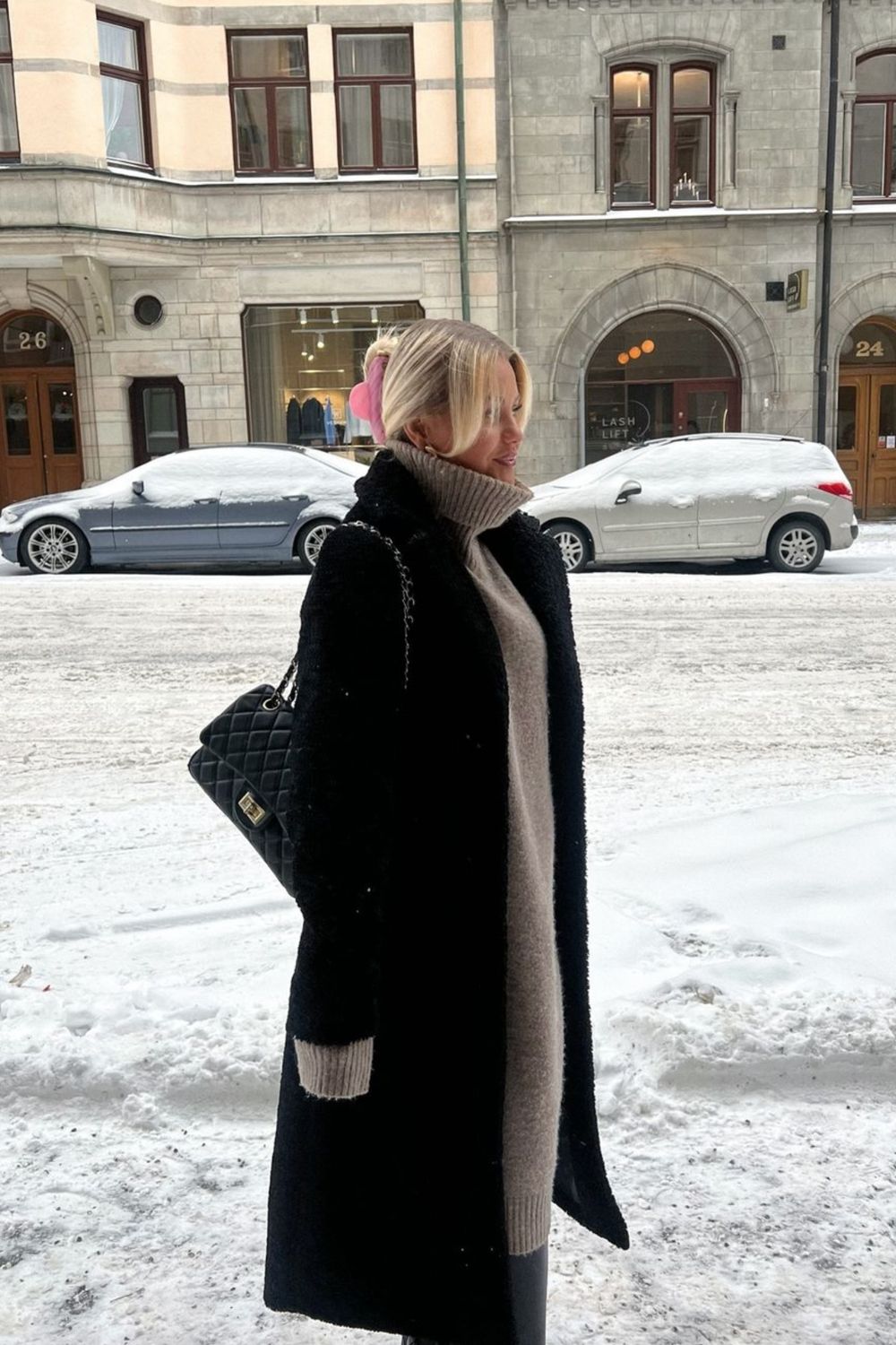 Long Black Textured Coat Over Beige Knit Dress — Europe Winter Outfits