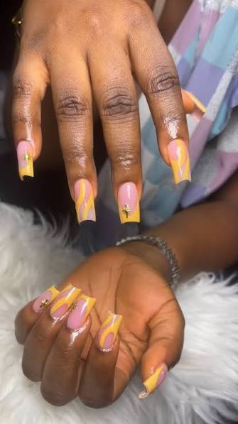 Yellow and Pink Swirls with Cross Charms Yellow and Pink Swirls with Cross Charms — yellow nail designs