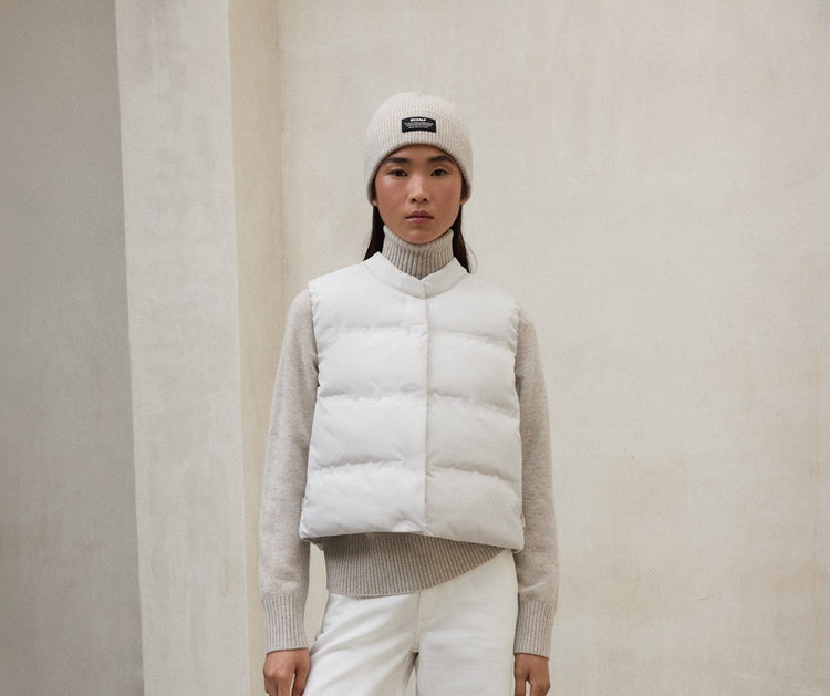 White Puffer Vest with Neutral Beanie — Puffer Vest Outfits