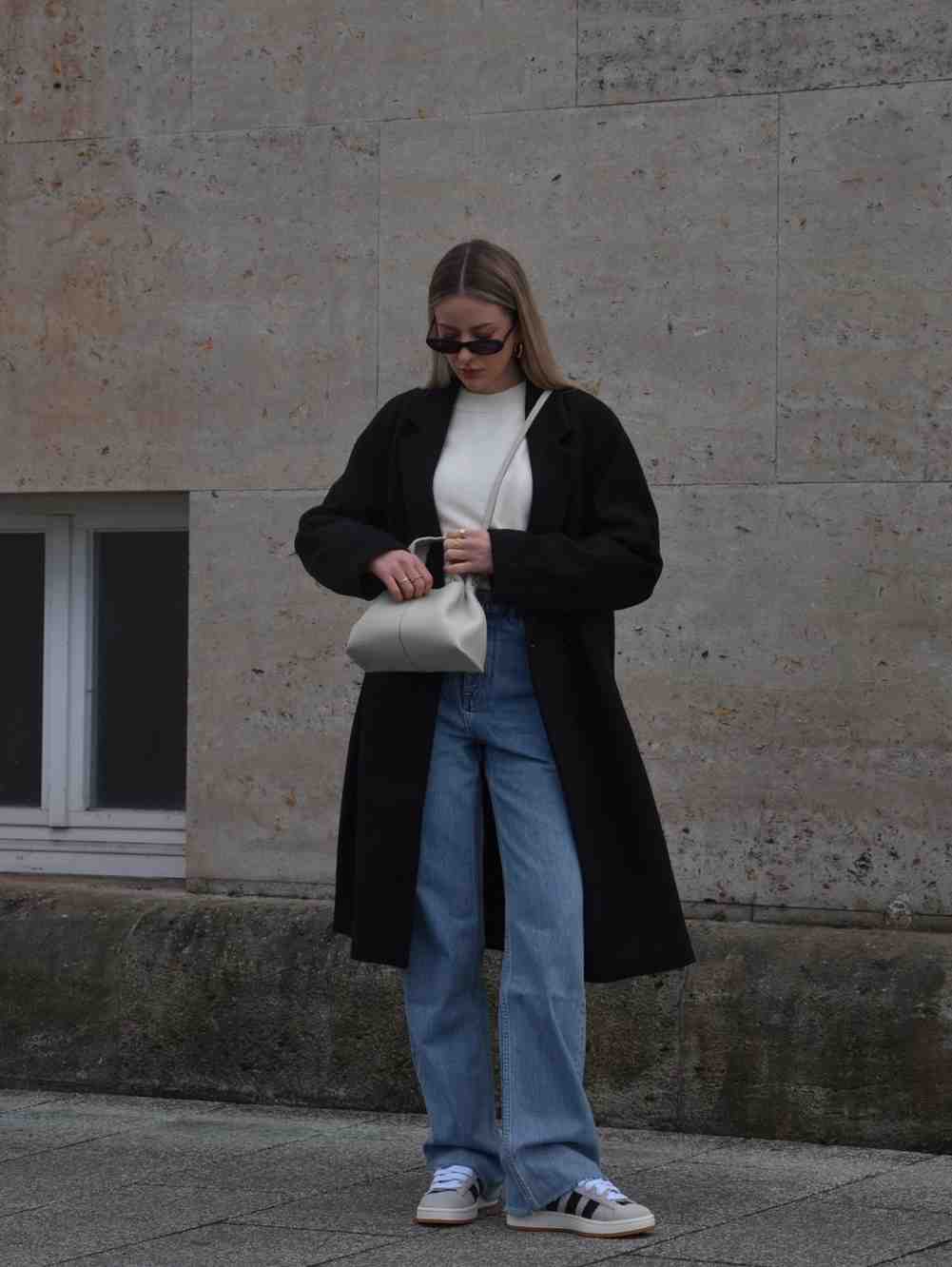 Minimalist Layers: Light Wash Wide-Leg Jeans with Long Black Coat — Winter Outfits with Jeans