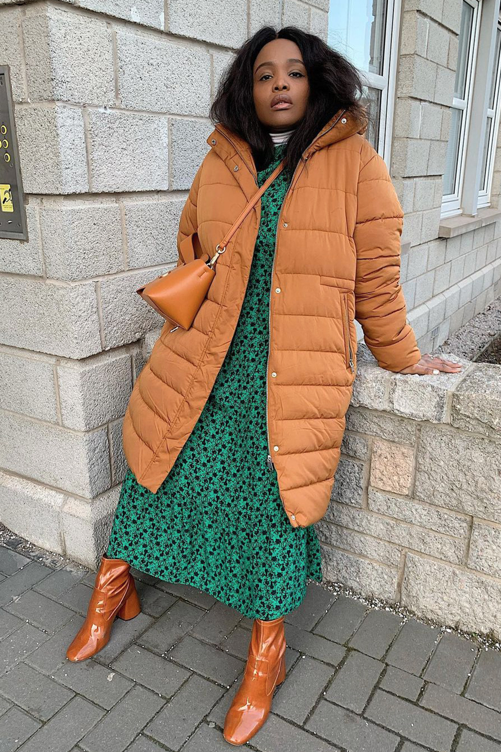 Bohemian Winter Layers: Long Brown Puffer with Floral Dress — Winter Puffer Jacket Outfits