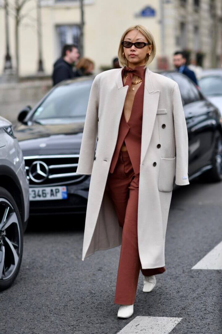 Oversized Beige Coat with Rust Vest and Tailored Trousers — Paris Winter Outfits