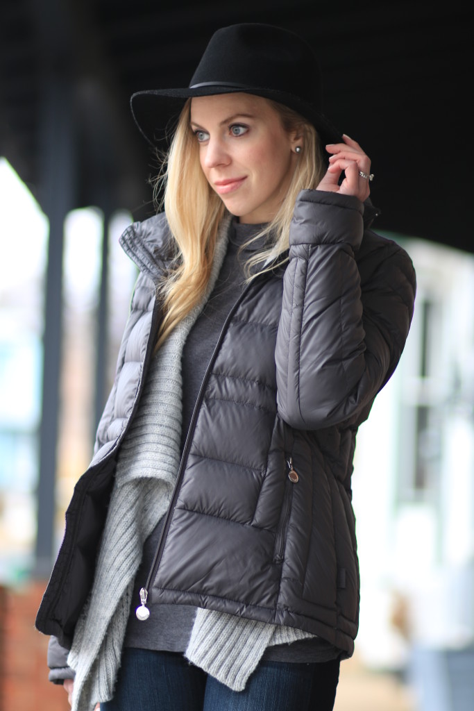 Cozy Chic: Dark Grey Puffer with Textured Knit and Fedora — Winter Puffer Jacket Outfits