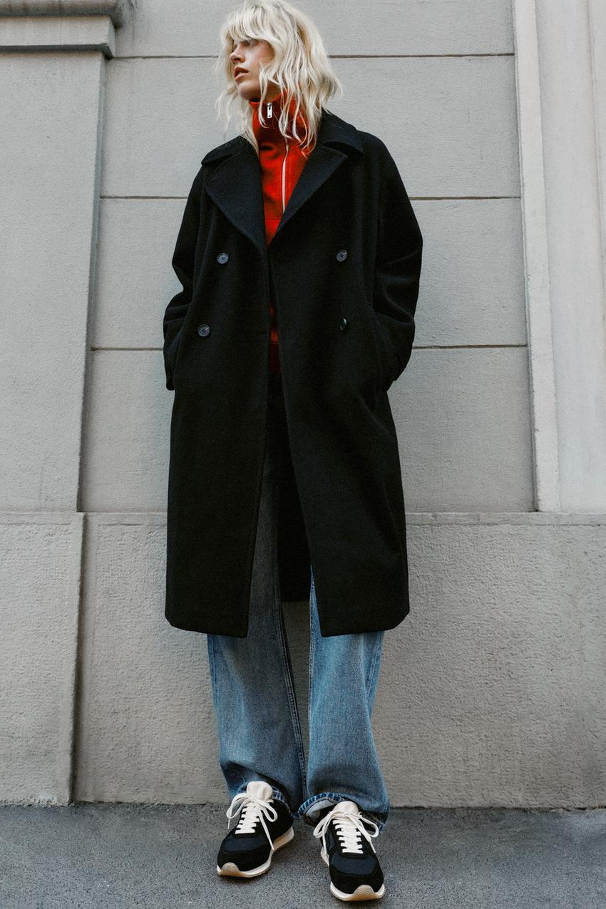 Sporty Contrast: Black Coat with Red Hoodie — Black Coat Outfits