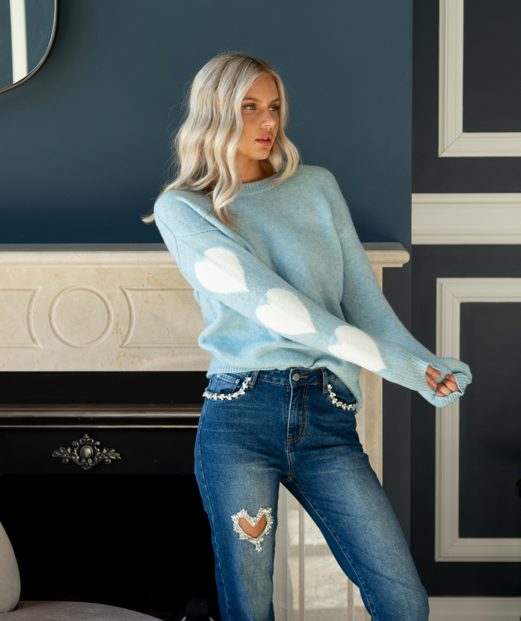 Embellished Jeans and Heart Detail Sweater for Casual Dinner — Winter Dinner Outfits