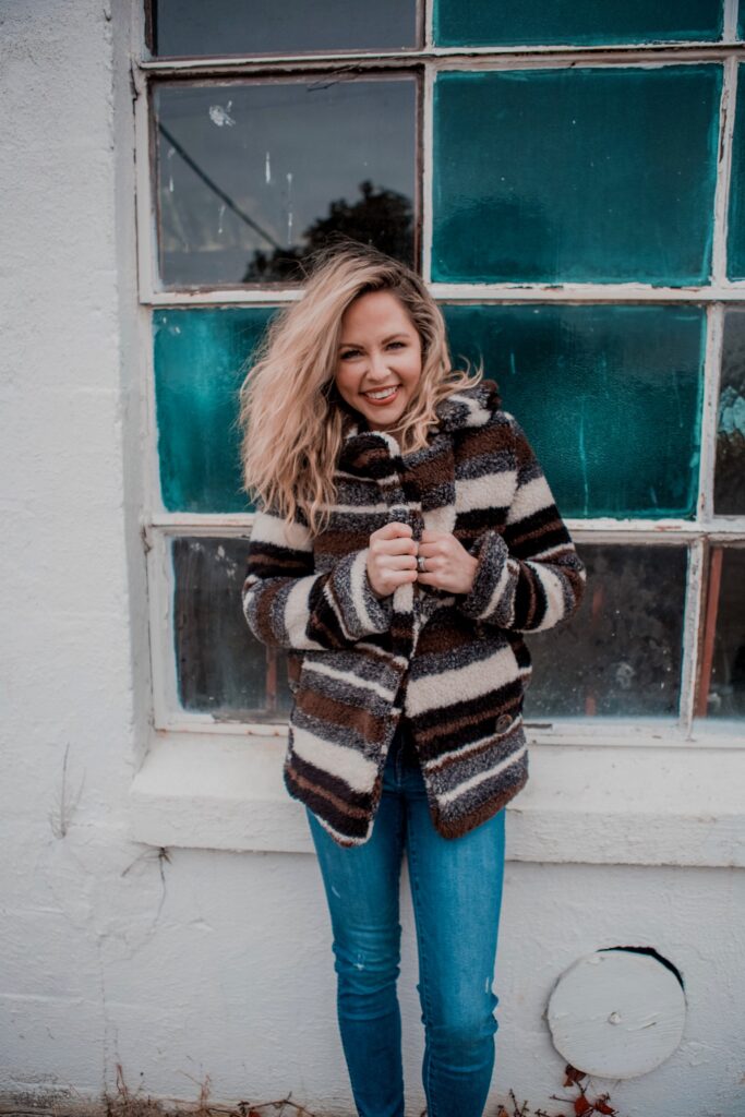 Playful Striped Fuzzy Jacket Over Denim for Winter Casual — Nashville Winter Outfits