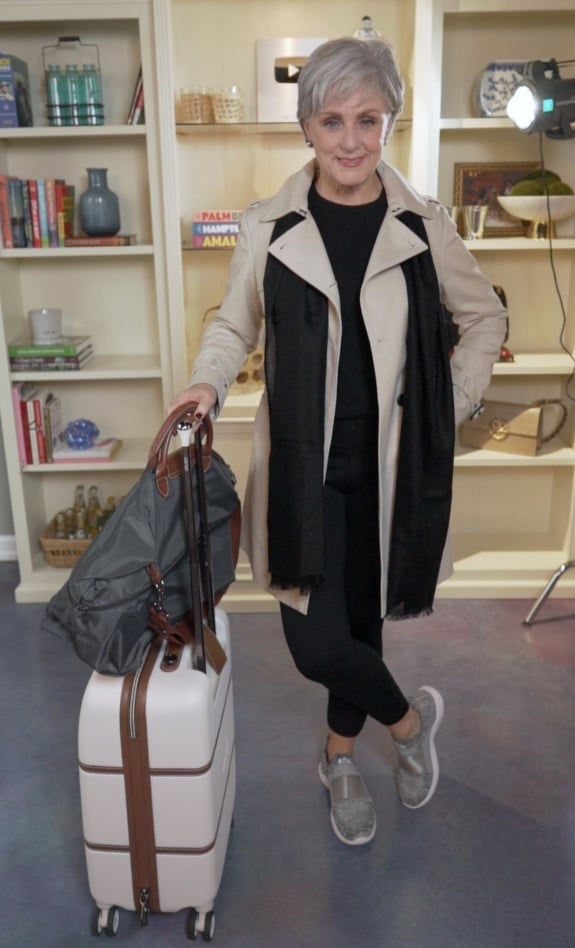 Beige Trench Coat Over Black Basics with Grey Sneakers — Winter Airport Outfits