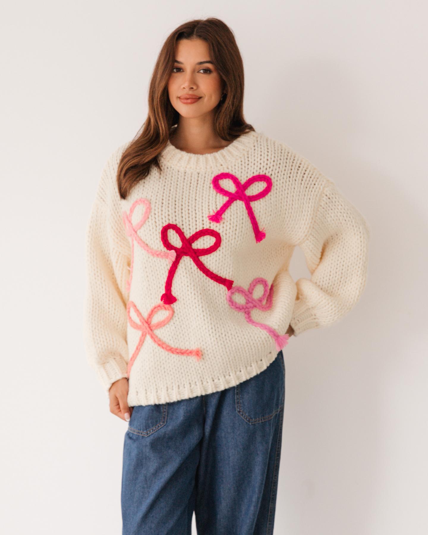 Oversized Cream Knit Sweater with Pink Bows and Denim — Boho Winter Outfits
