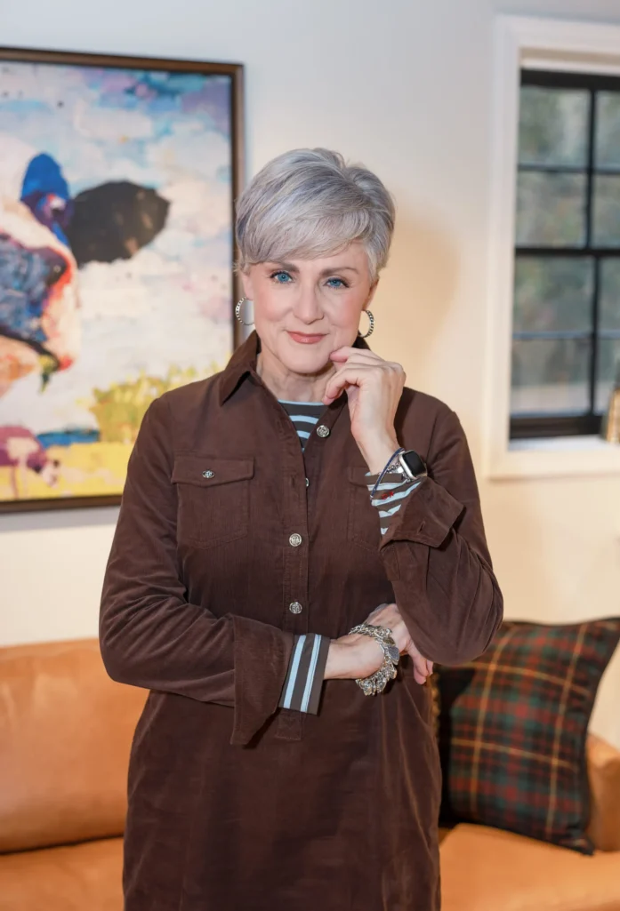 Brown Corduroy Dress Over Striped Top for a Stylish Holiday Look Brown Corduroy Dress Over Striped Top for a Stylish Holiday Look — Winter Outfits for Women Over 60