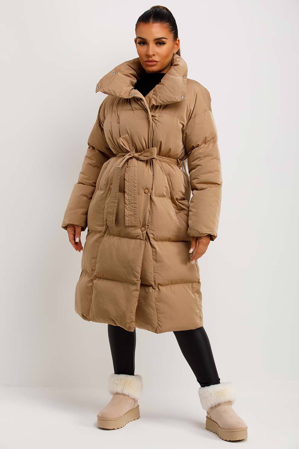 Camel Puffer with Tie Belt and Fur-Lined Boots — Long Puffer Coat Outfits