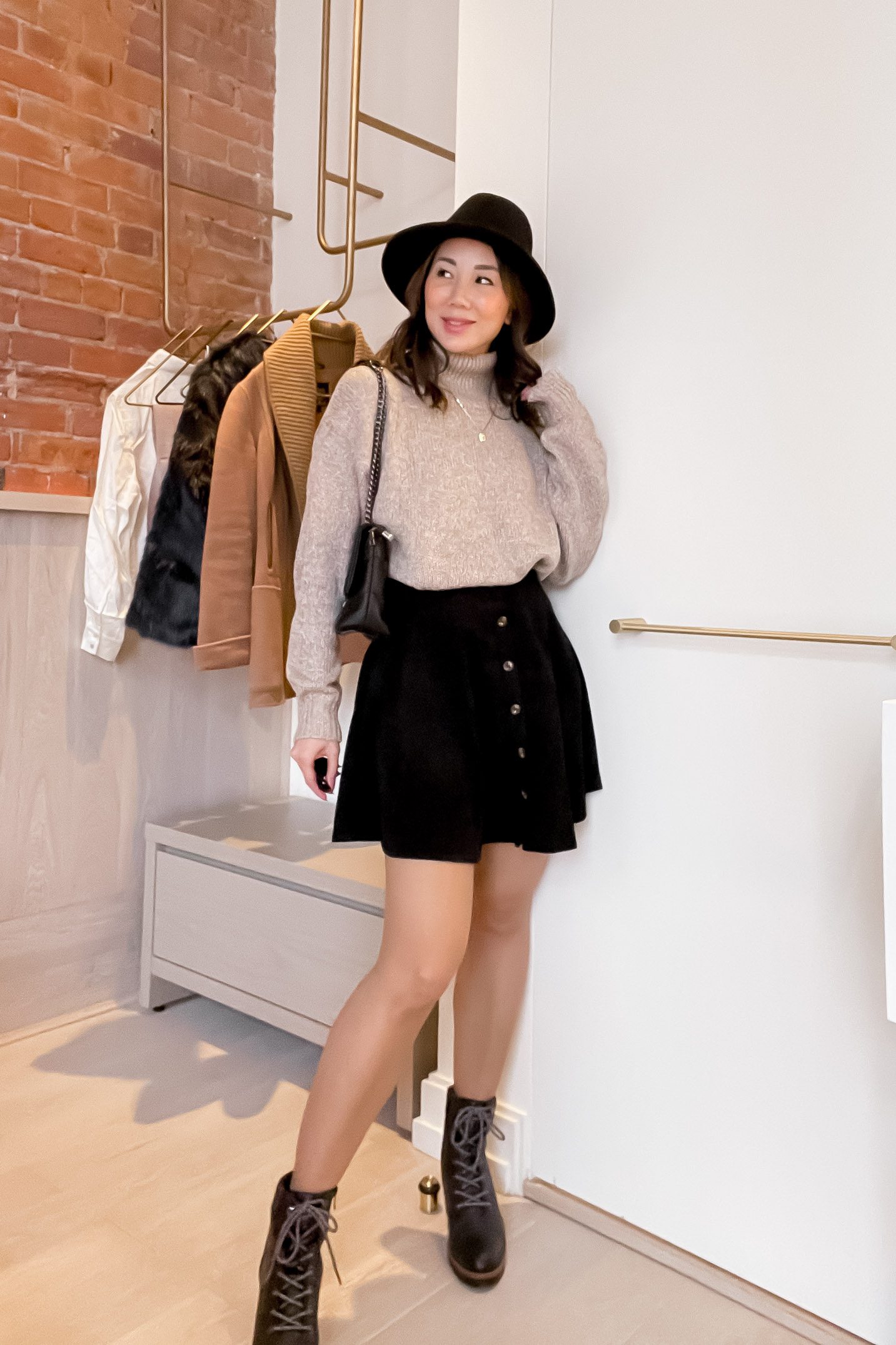 Black Suede Mini Skirt with Turtleneck and Lace-Up Boots — Winter Skirt Outfits