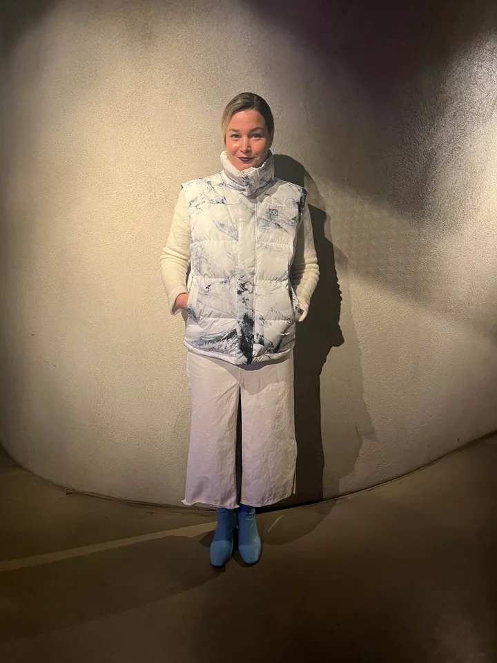 Marble Puffer Vest with Bright Blue Boots — Iceland Winter Outfits