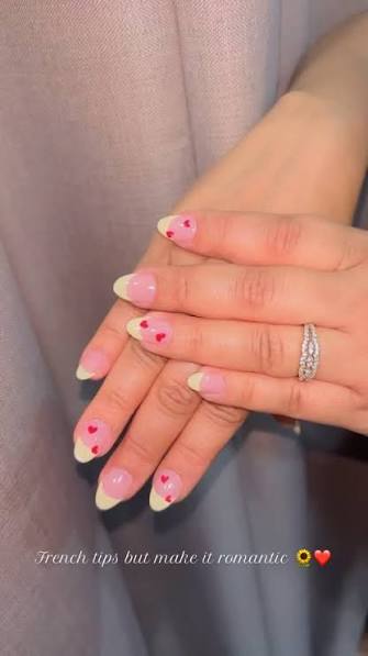 Sheer Pink Almond with Pale Yellow French Tips and Hearts — trendy almond nail designs