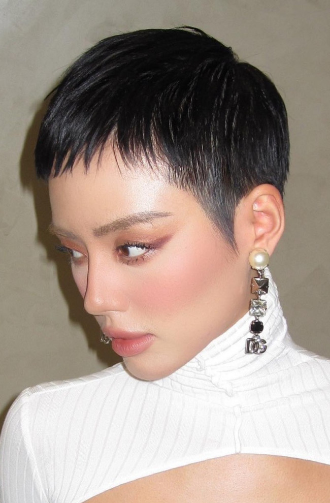 Sleek Black Pixie with Sharp Sideburns Sleek Black Pixie with Sharp Sideburns — very short women haircuts