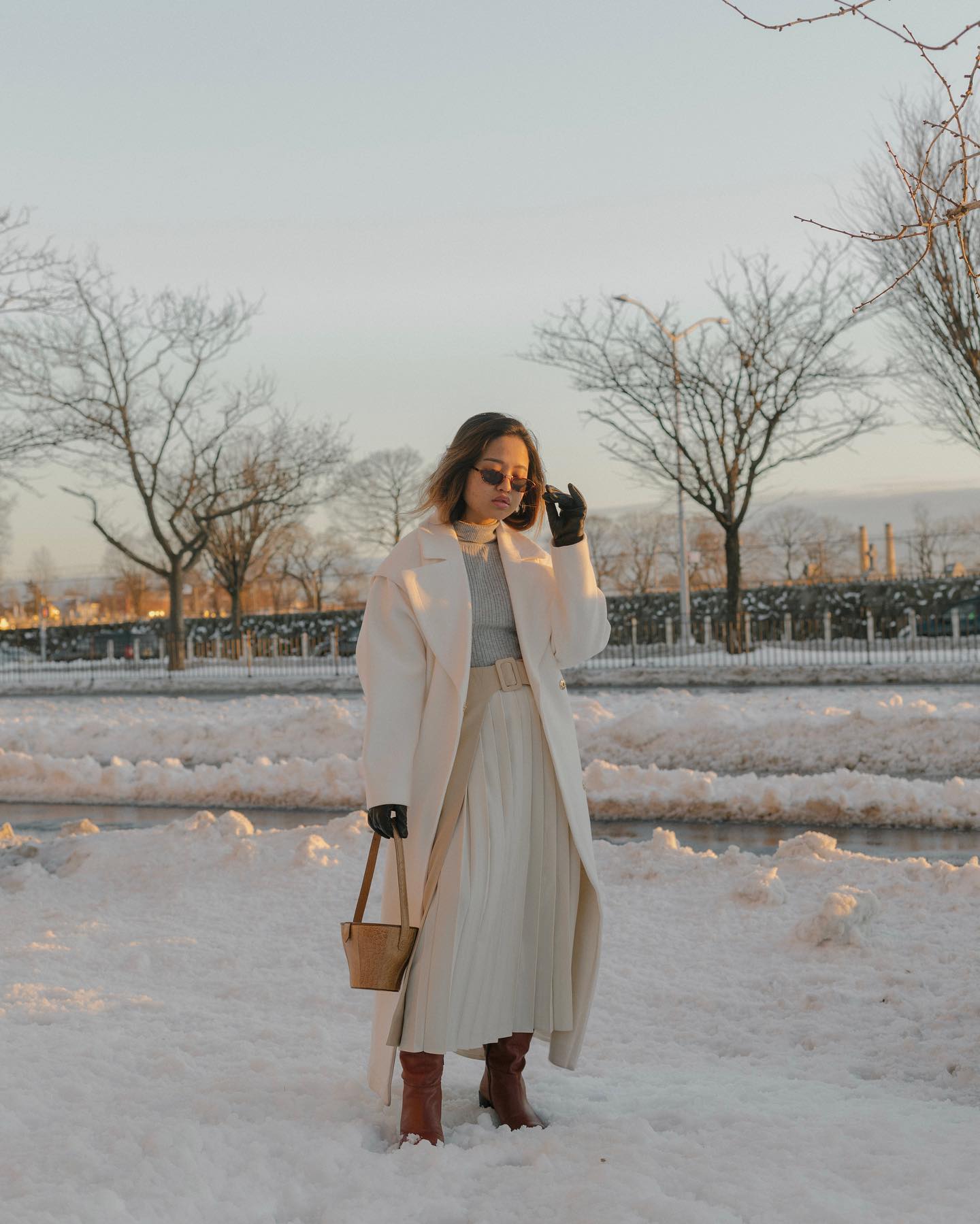 Elegant Winter White: Long Coat Over Knit and Skirt Elegant Winter White: Long Coat Over Knit and Skirt — Winter Layering Outfits