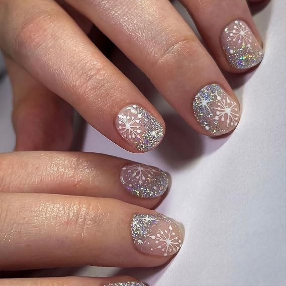 Glittering Snowflakes on Sheer Base Glittering Snowflakes on Sheer Base — Short Winter Acrylic Nails