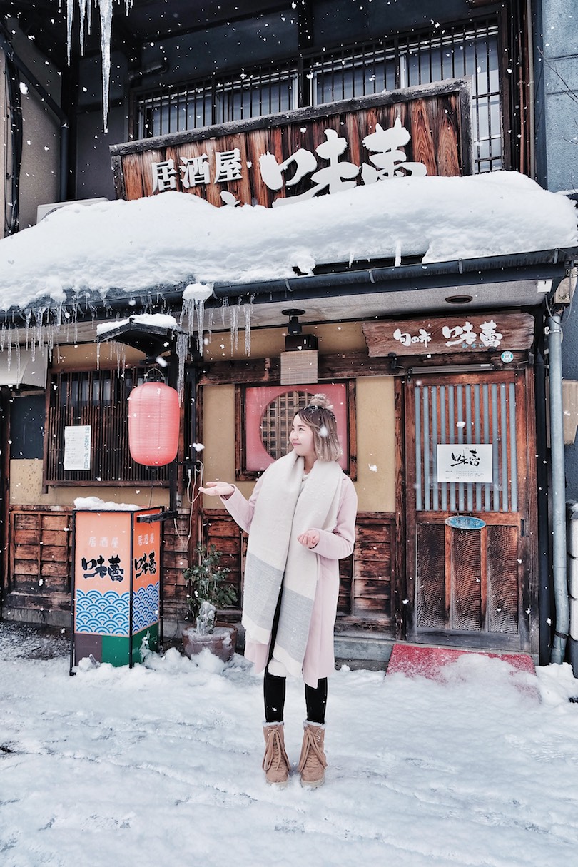 Long Pink Wool Coat with Lace-Up Boots in a Snowy Village — Japan Winter Outfits