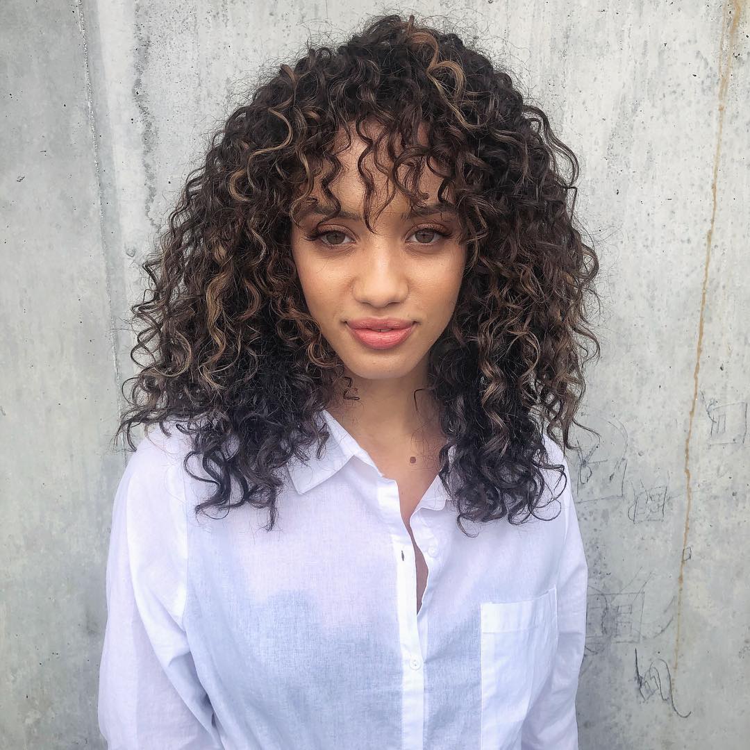 Front View Dark Brown With Caramel Highlights and Curtain Bangs — Winter Hair Colors for Curly Hair