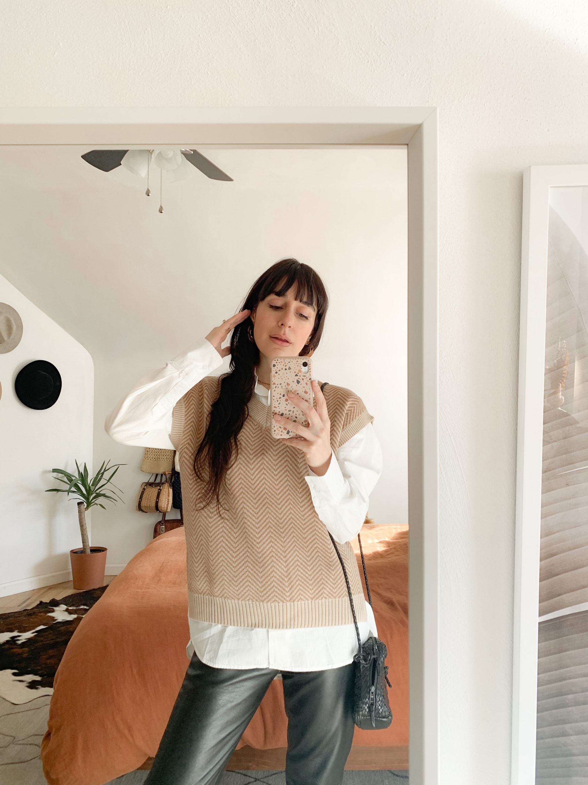 Chevron Knit Vest Over White Shirt and Leather Pants — Late Winter Outfits