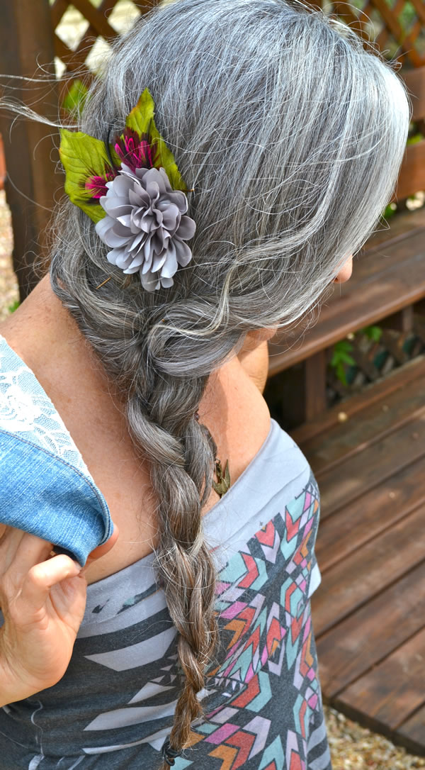 Mid-Back Braid with Flower Accessory Mid-Back Braid with Flower Accessory — Winter Haircuts for Gray Hair