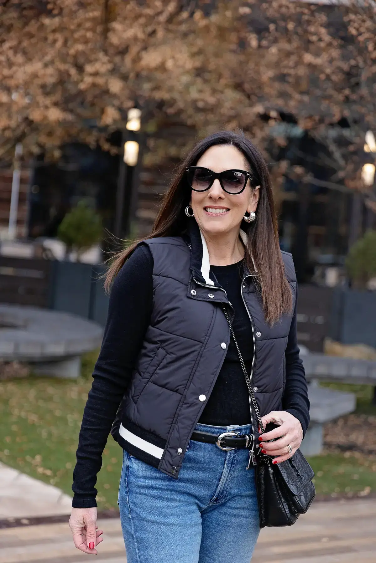 Puffer Vest with White Trim Over Long-Sleeve and Denim — Puffer Vest Outfits