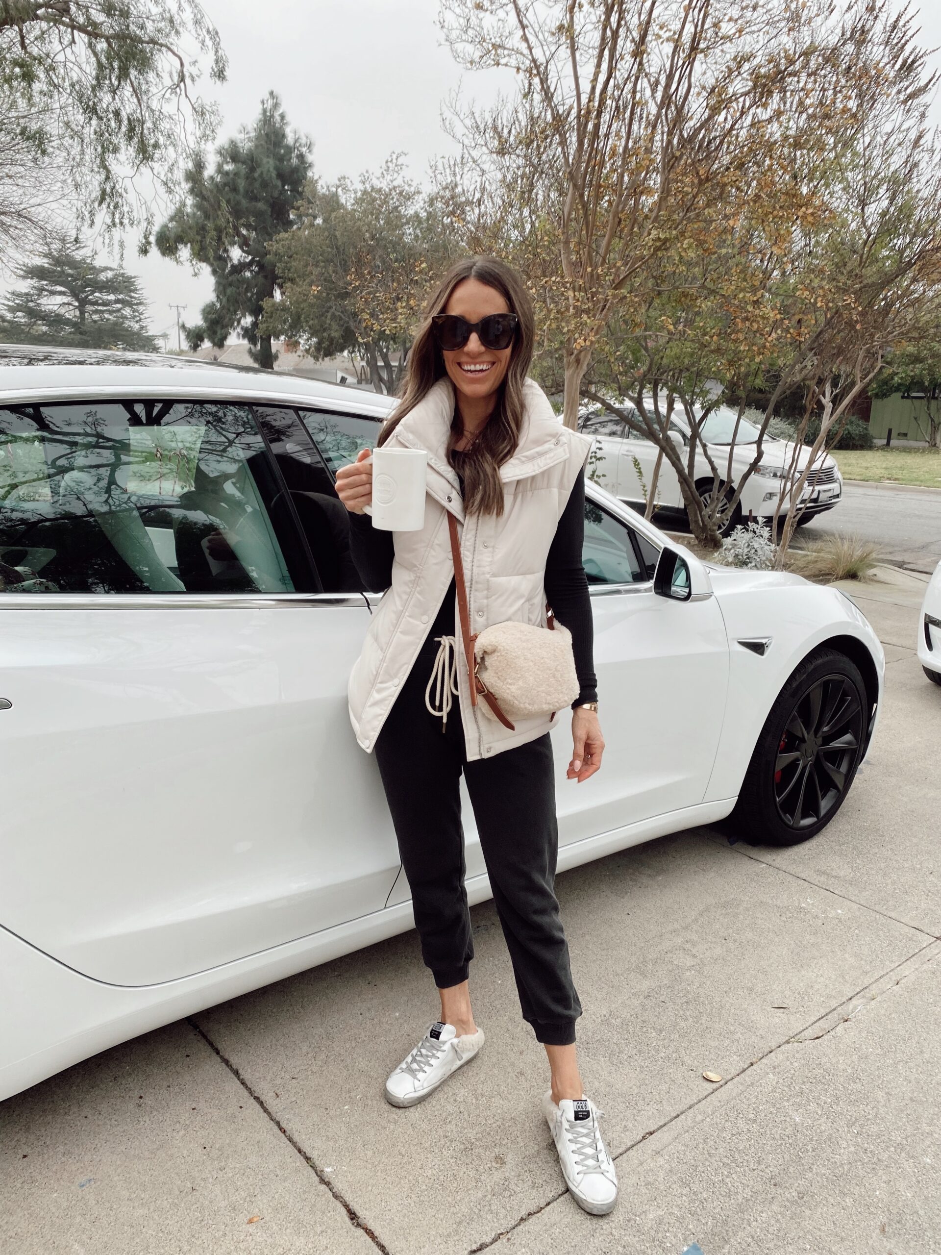 Cream Puffer Vest with Black Joggers and Shearling Accents — Puffer Vest Outfits