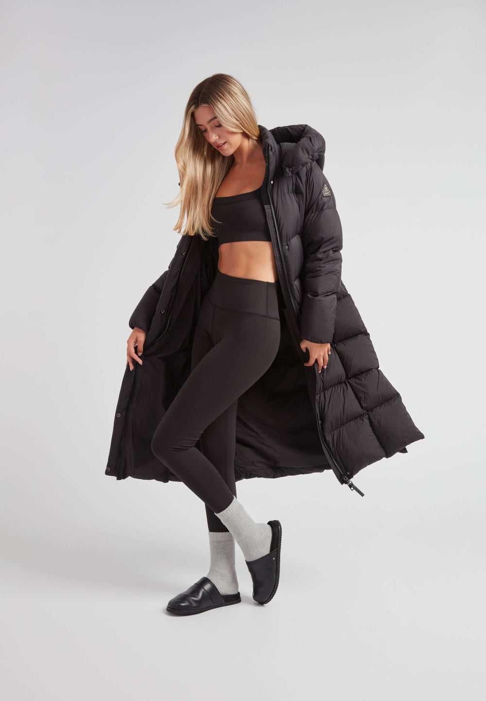 Ultra-Long Black Puffer with Sports Bra and Leggings — Long Puffer Coat Outfits