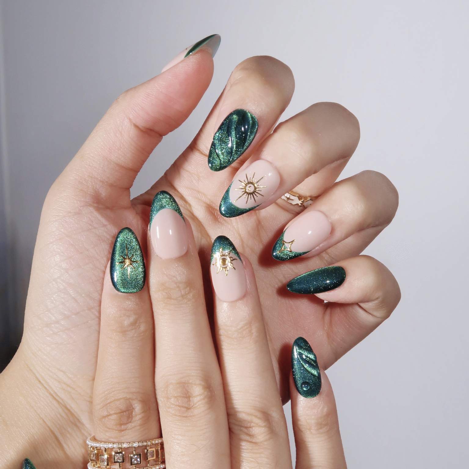 Shimmering Emerald French with Celestial Motifs Shimmering Emerald French with Celestial Motifs — Emerald Green Nails