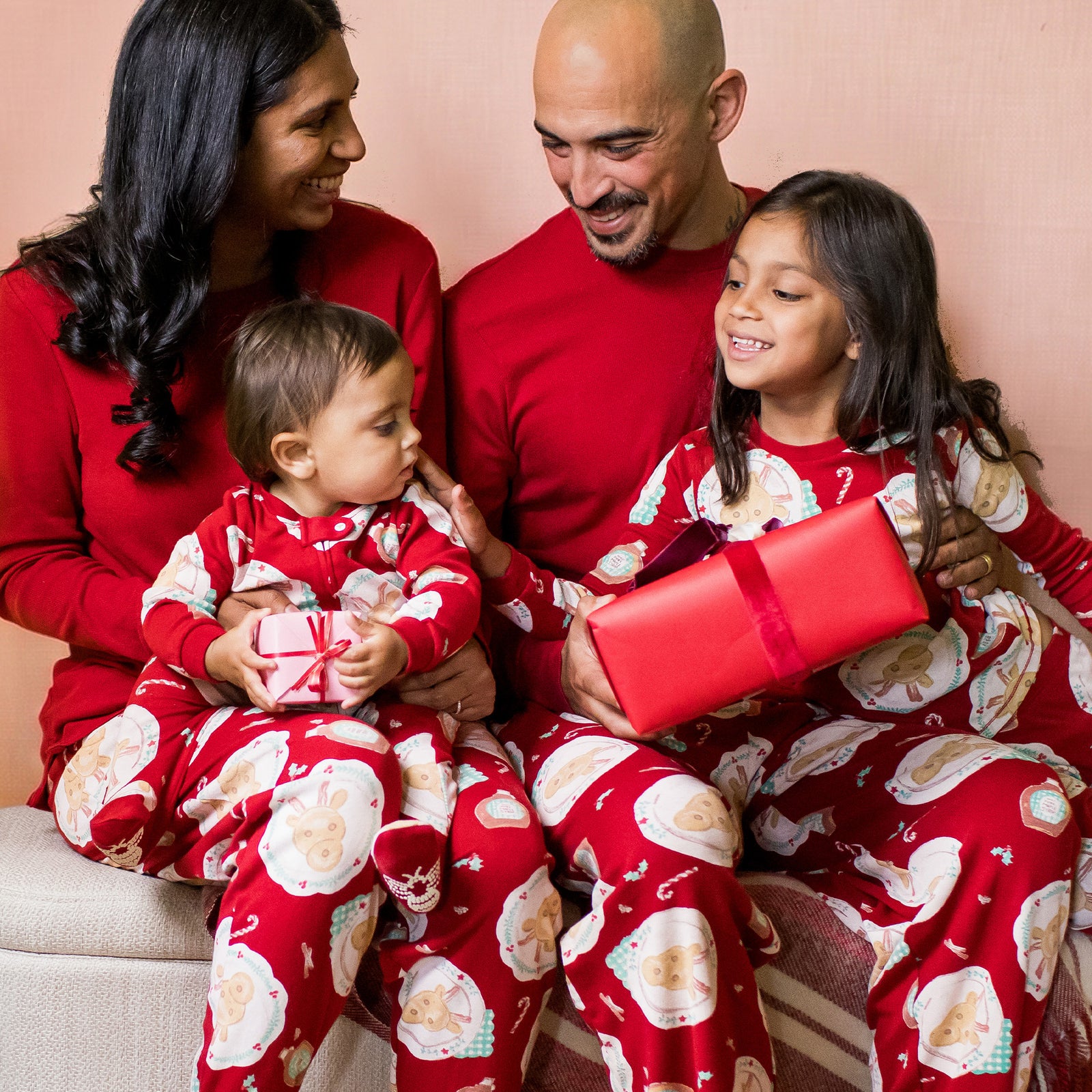 Matching Red Pajamas with Festive Print for a Unified Family Look Matching Red Pajamas with Festive Print for a Unified Family Look — Winter Family Photo Outfits
