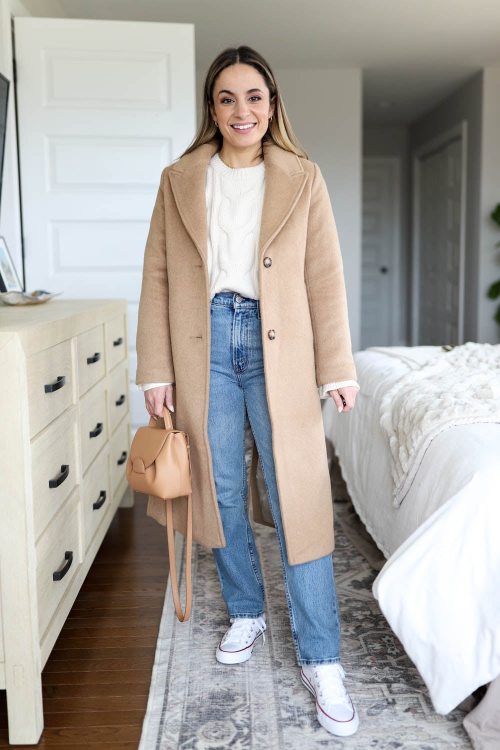 Camel Coat, Cream Sweater, Blue Jeans, and White Low-Top Sneakers Camel Coat, Cream Sweater, Blue Jeans, and White Low-Top Sneakers — Winter Outfits with Sneakers