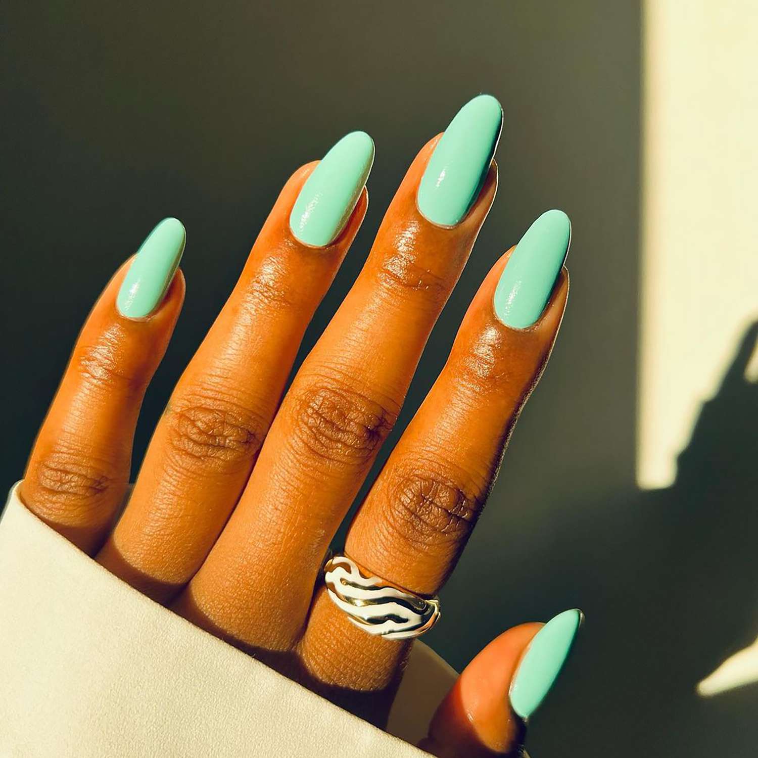 Glossy Mint Green Long Almond Nails Glossy Mint Green Long Almond Nails — Winter Nail Colors for Dark Skin