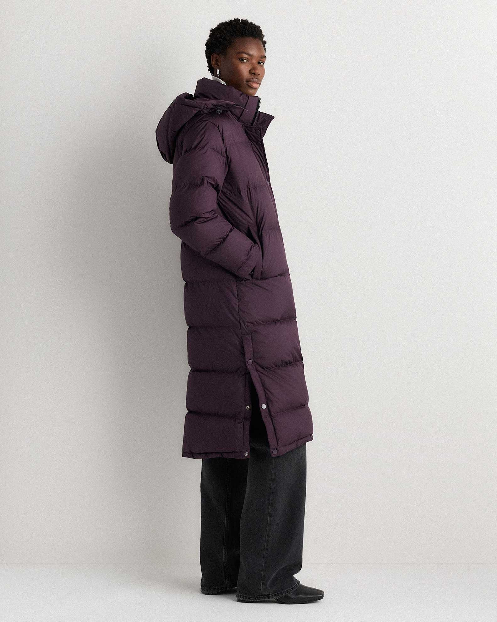 Deep Orchid Puffer Coat with White Turtleneck and Black Jeans — Long Puffer Coat Outfits