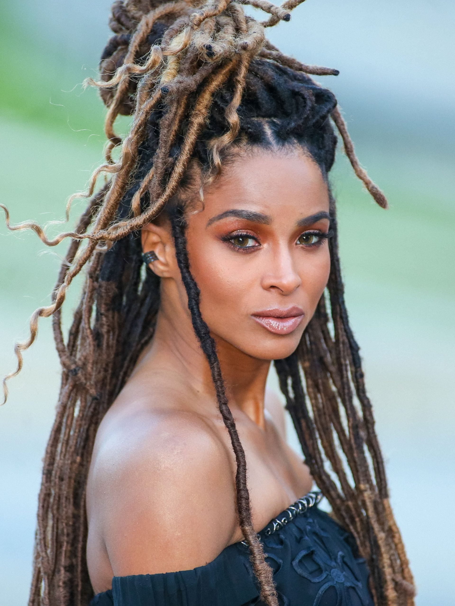 Dreadlocks With Blonde Highlights Styled Up Dreadlocks With Blonde Highlights Styled Up — Winter Haircuts for Black Women