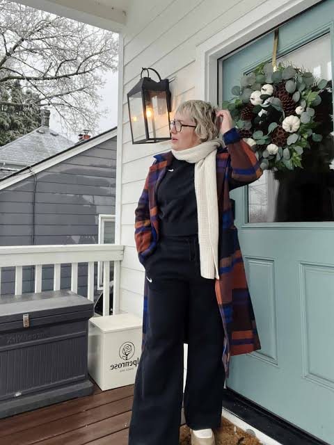 Bold Patterned Coat Over Black Basics and Sneakers — Late Winter Outfits