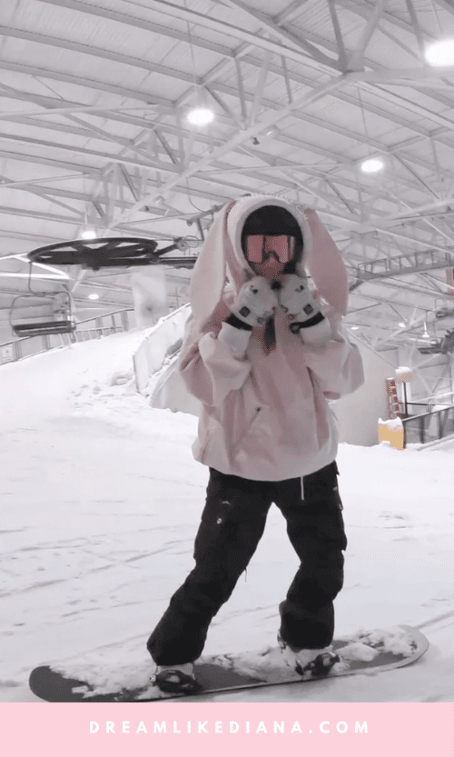 Playful Pink Jacket with Bunny Ears and Black Pants Playful Pink Jacket with Bunny Ears and Black Pants — Snowboarding Outfits